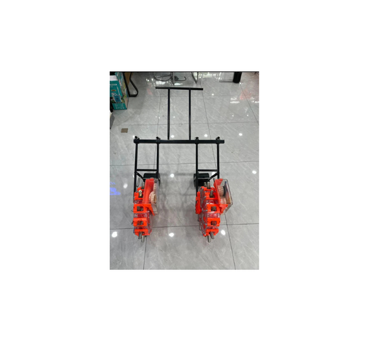 Handle to connect two manual seeder