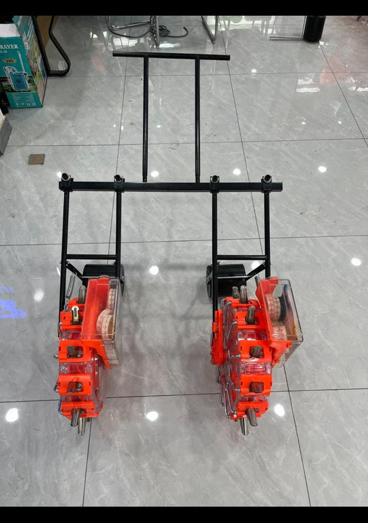 Handle to connect two manual seeder